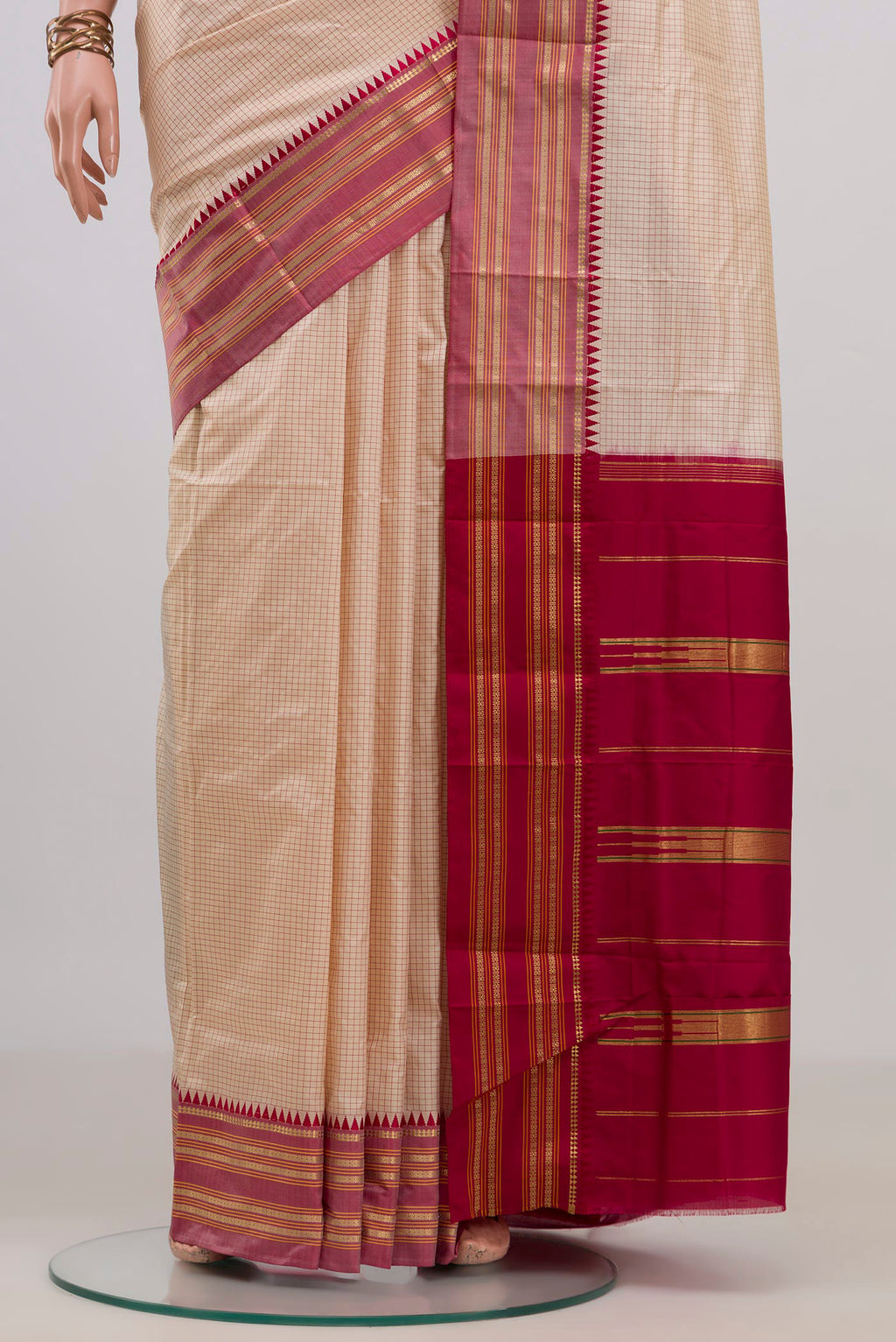 Pleats and pallu of Pure Silk Cream Narayanpet Saree with Checked design on the body and Zari Border. 