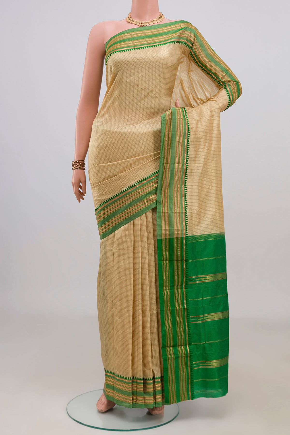 Pure Silk Cream Narayanpet Saree with Checked design on the body and Zari Border.  displayed on a mannequin