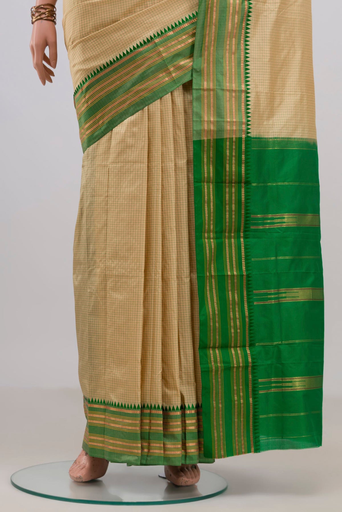 Pleats and pallu of Pure Silk Cream Narayanpet Saree with Checked design on the body and Zari Border. 