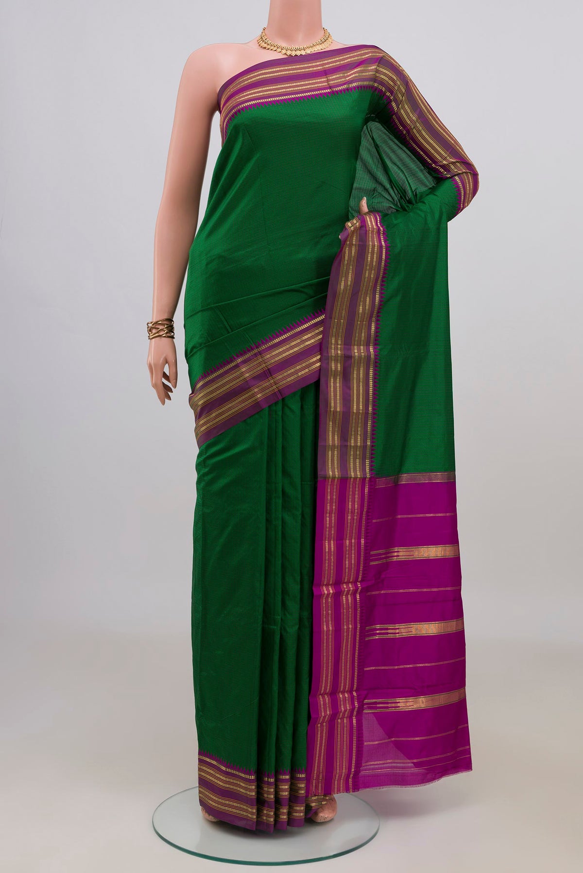 Pure Silk Green Narayanpet Saree with Checked design on the body and Zari Border.  displayed on a mannequin