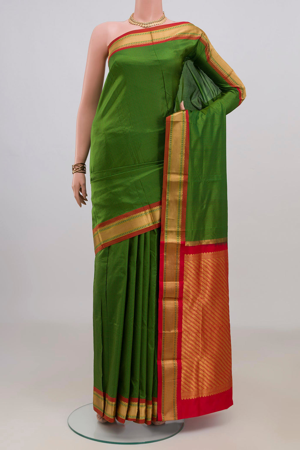 Pure Silk Green Narayanpet Saree with Checked design on the body and Zari Border.  displayed on a mannequin