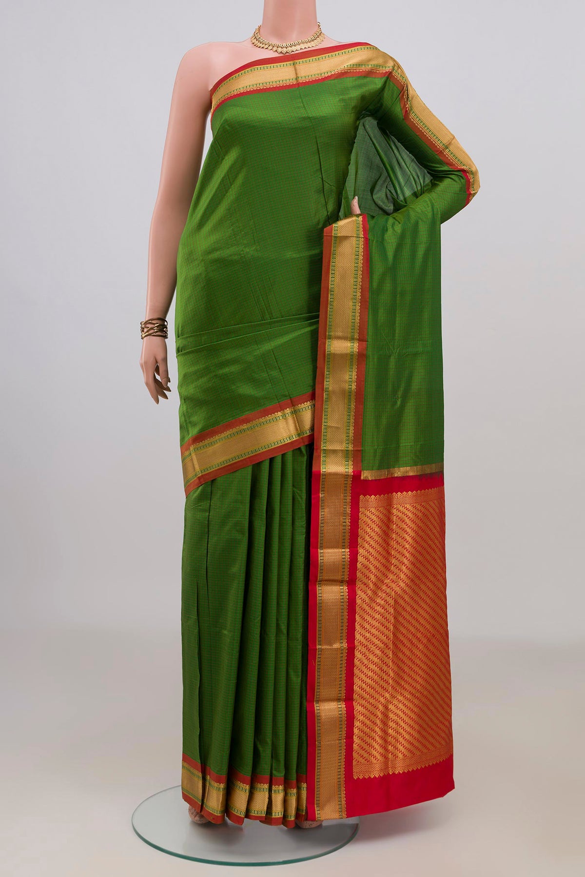 Pure Silk Green Narayanpet Saree with Checked design on the body and Zari Border.  displayed on a mannequin