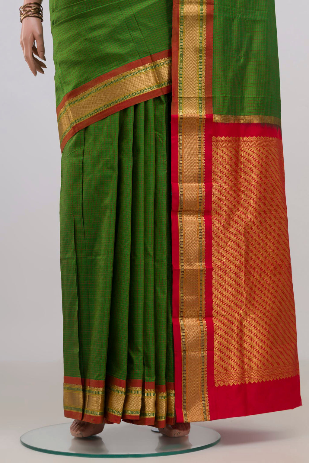 Pleats and pallu of Pure Silk Green Narayanpet Saree with Checked design on the body and Zari Border. 