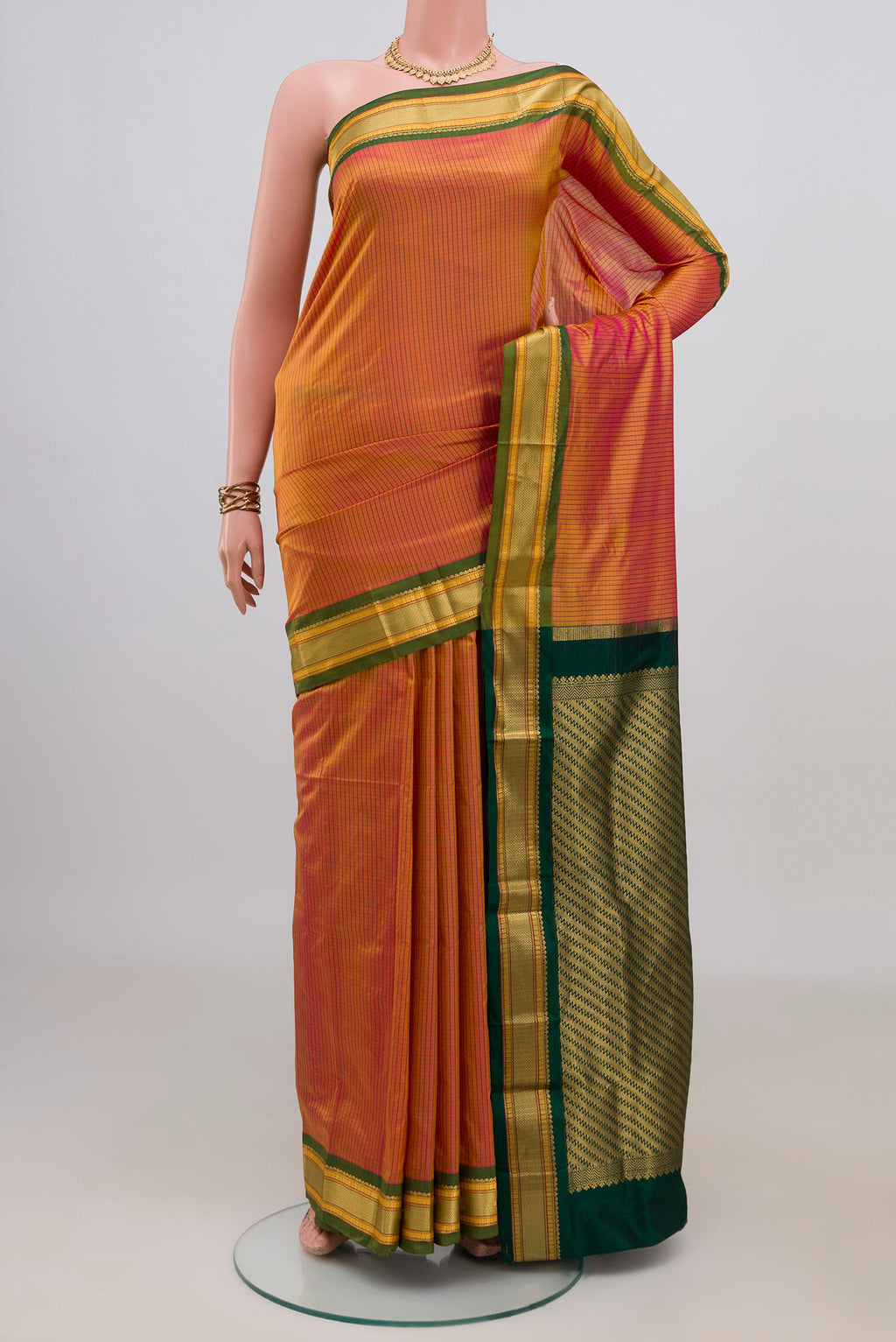 Pure Silk Yellow Narayanpet Saree with Checked design on the body and Zari Border.  displayed on a mannequin