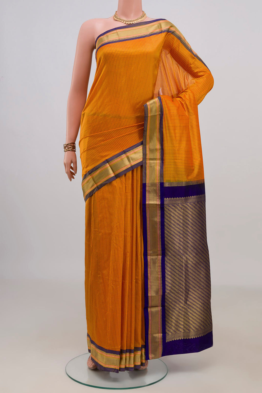 Pure Silk Yellow Narayanpet Saree with Checked design on the body and Zari Border.  displayed on a mannequin