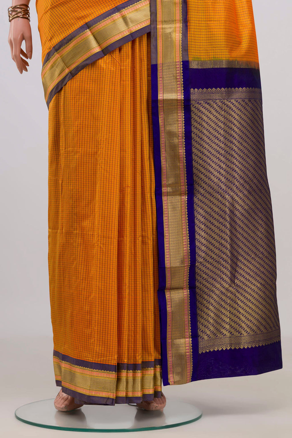Pleats and pallu of Pure Silk Yellow Narayanpet Saree with Checked design on the body and Zari Border. 