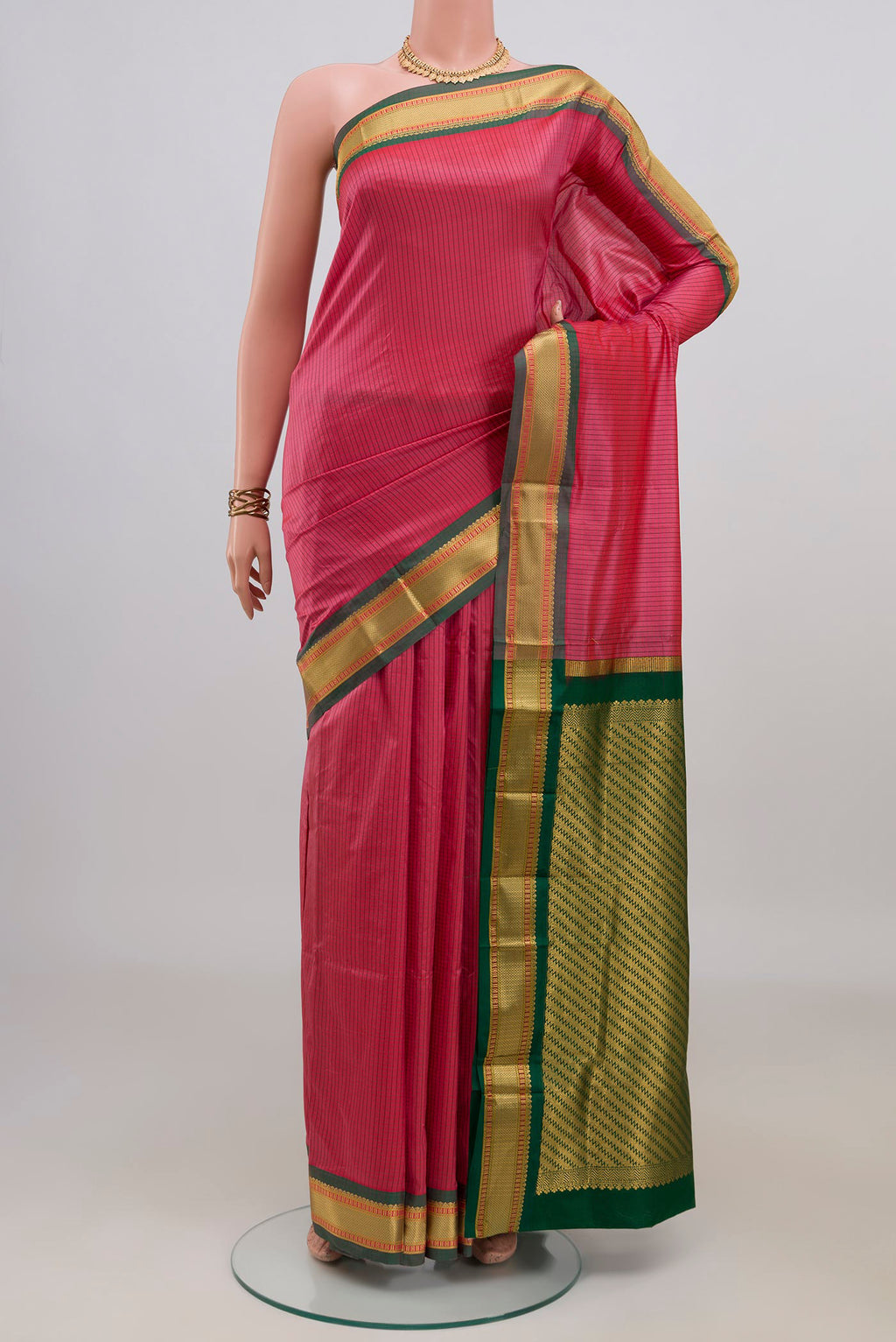 Pure Silk Coral Narayanpet Saree with Checked design on the body and Zari Border.  displayed on a mannequin
