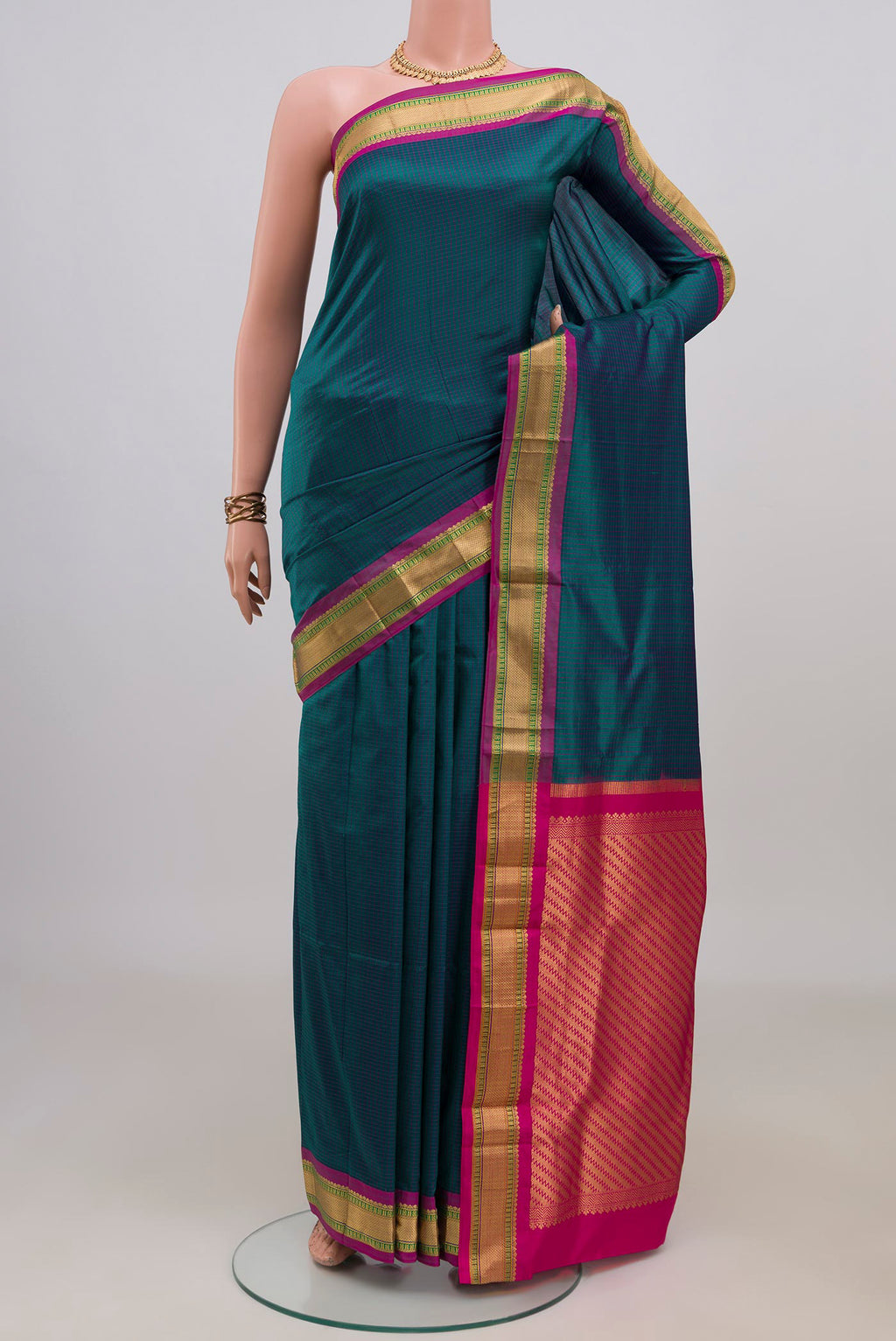Pure Silk Blue Narayanpet Saree with Checked design on the body and Zari Border.  displayed on a mannequin
