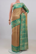 Golden Dual Tone Kanjivaram Tissue Saree with Zari Brocade on the body and Fancy Border.  displayed on a mannequin