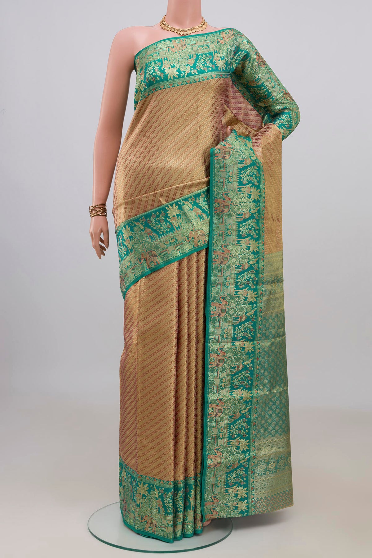 Golden Dual Tone Kanjivaram Tissue Saree with Zari Brocade on the body and Fancy Border.  displayed on a mannequin