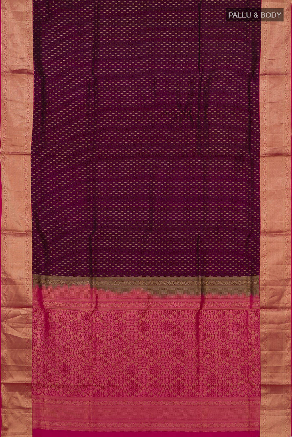 Flat view of Pure Silk Magenta Soft Saree with Zari Butta on the body and Zari Border. 