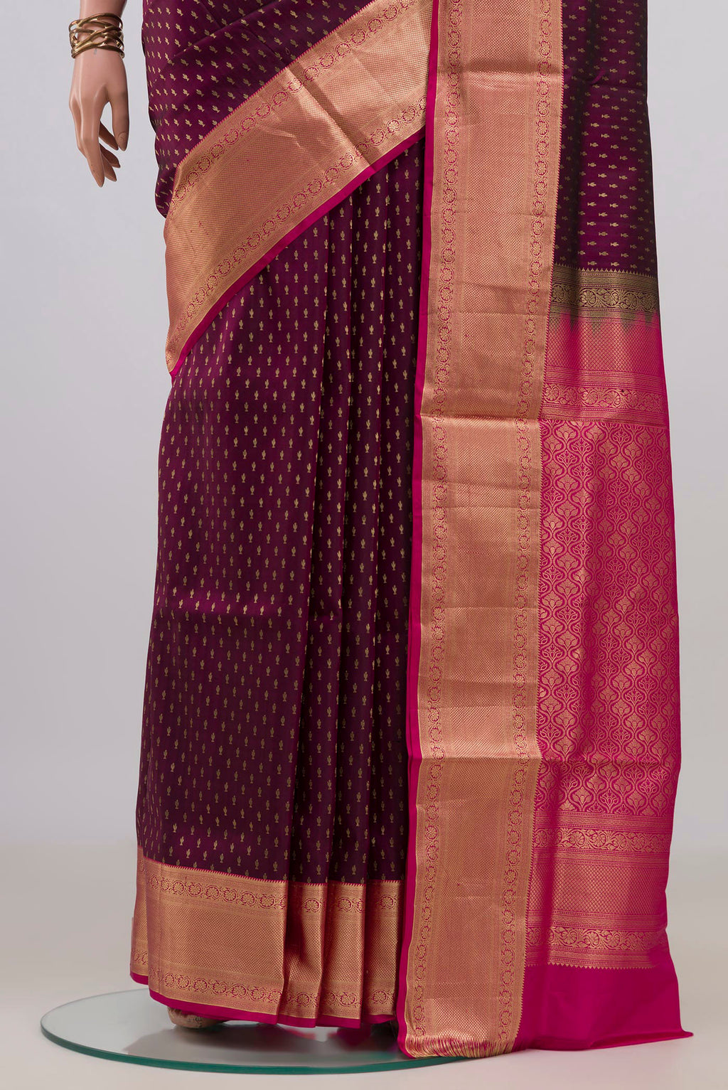 Pleats and pallu of Pure Silk Magenta Soft Saree with Zari Butta on the body and Zari Border. 