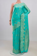 Pure Silk Sea Green Soft Saree with Zari Butta on the body and Fancy Border.  displayed on a mannequin