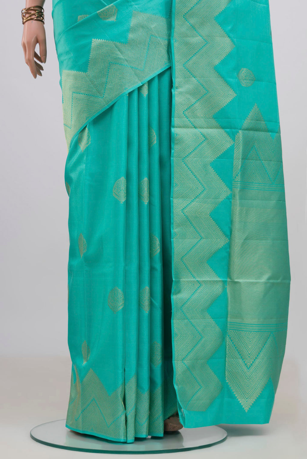 Pleats and pallu of Pure Silk Sea Green Soft Saree with Zari Butta on the body and Fancy Border. 
