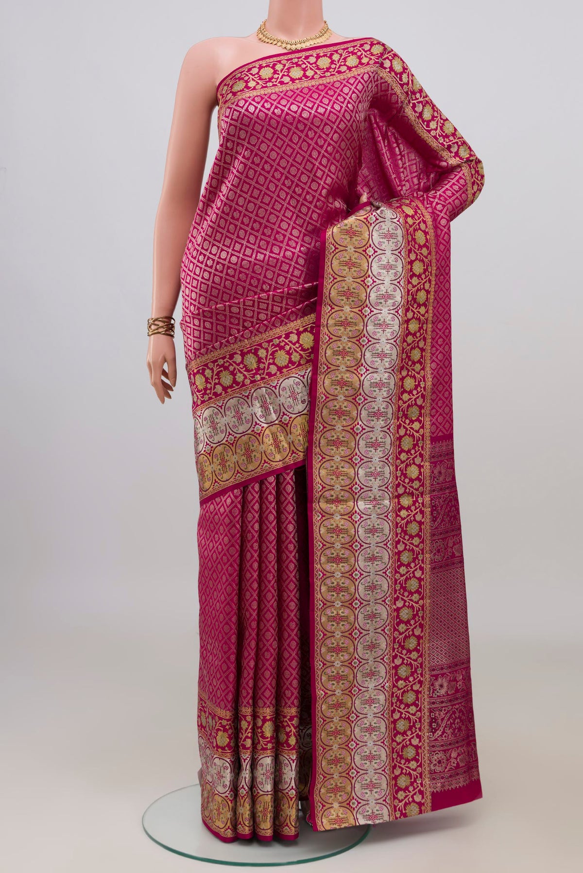 Pure Silk Dark Pink Kanchipuram Saree with Zari Brocade on the body and Fancy Border.  displayed on a mannequin