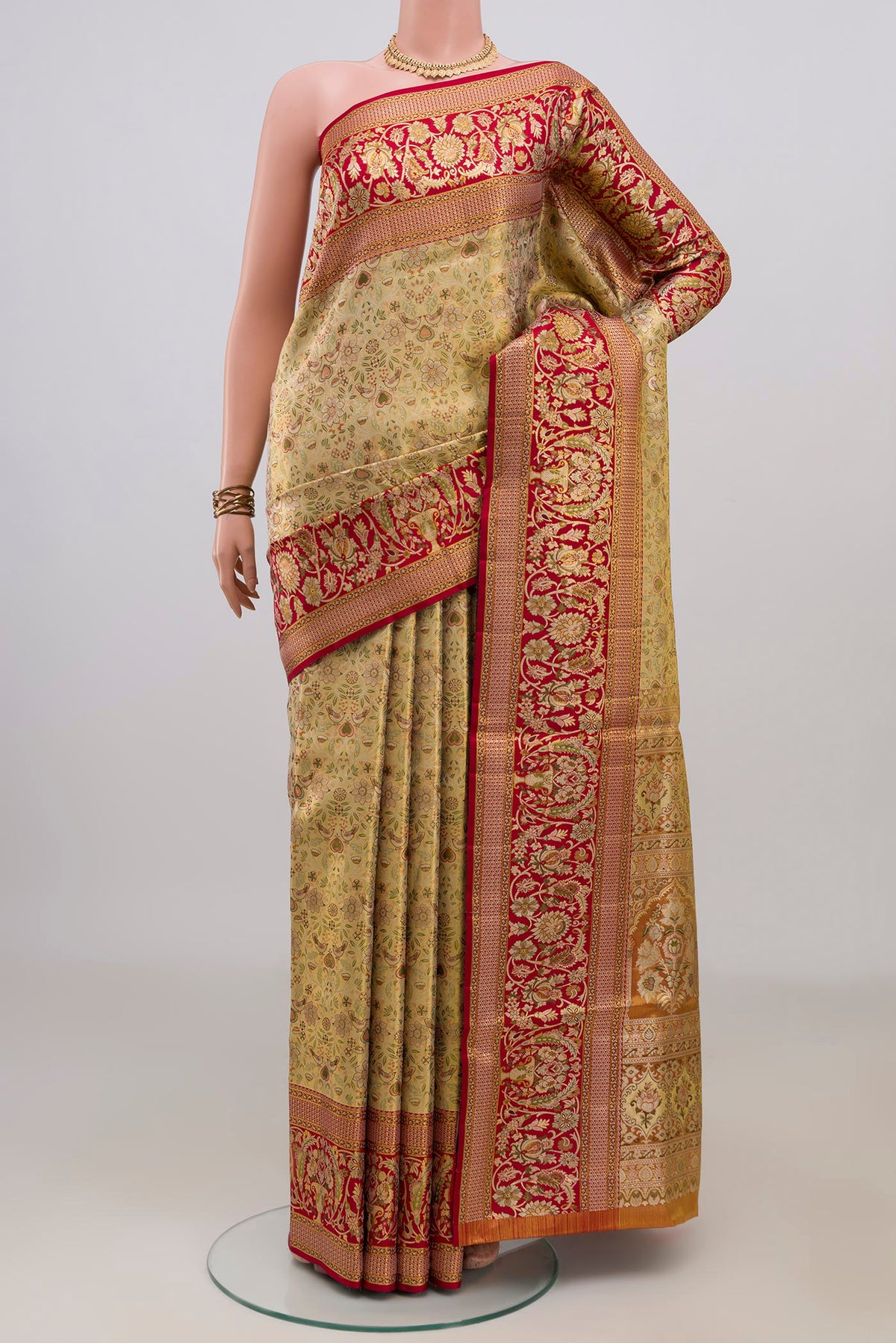 Golden Dual Tone Kanchipuram Tissue Saree with Zari Brocade on the body and Fancy Border.  displayed on a mannequin