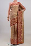 Golden Peach Kanchipuram Tissue Saree with Zari Brocade on the body and Fancy Border.  displayed on a mannequin