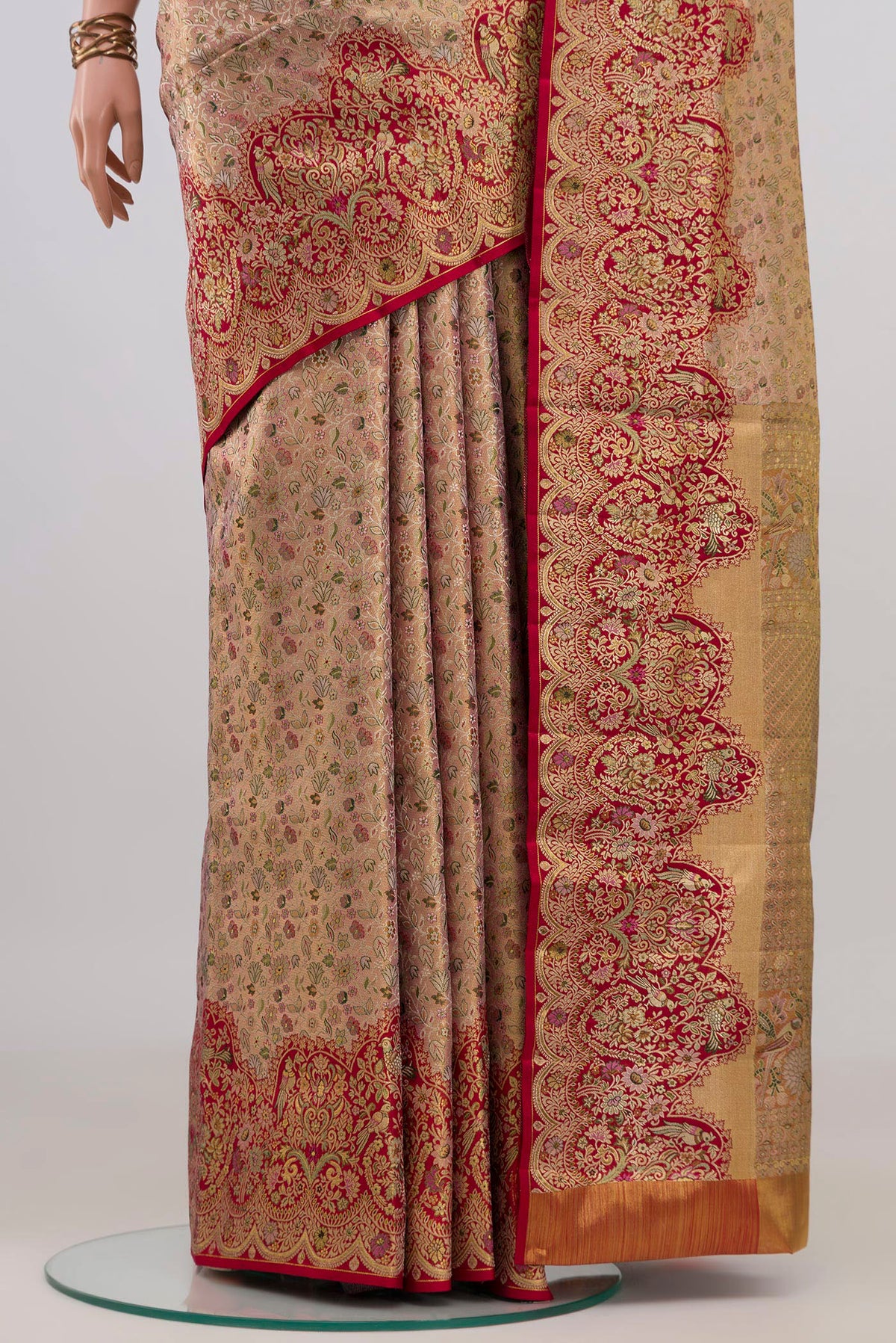 Pleats and pallu of Golden Peach Kanchipuram Tissue Saree with Zari Brocade on the body and Fancy Border. 