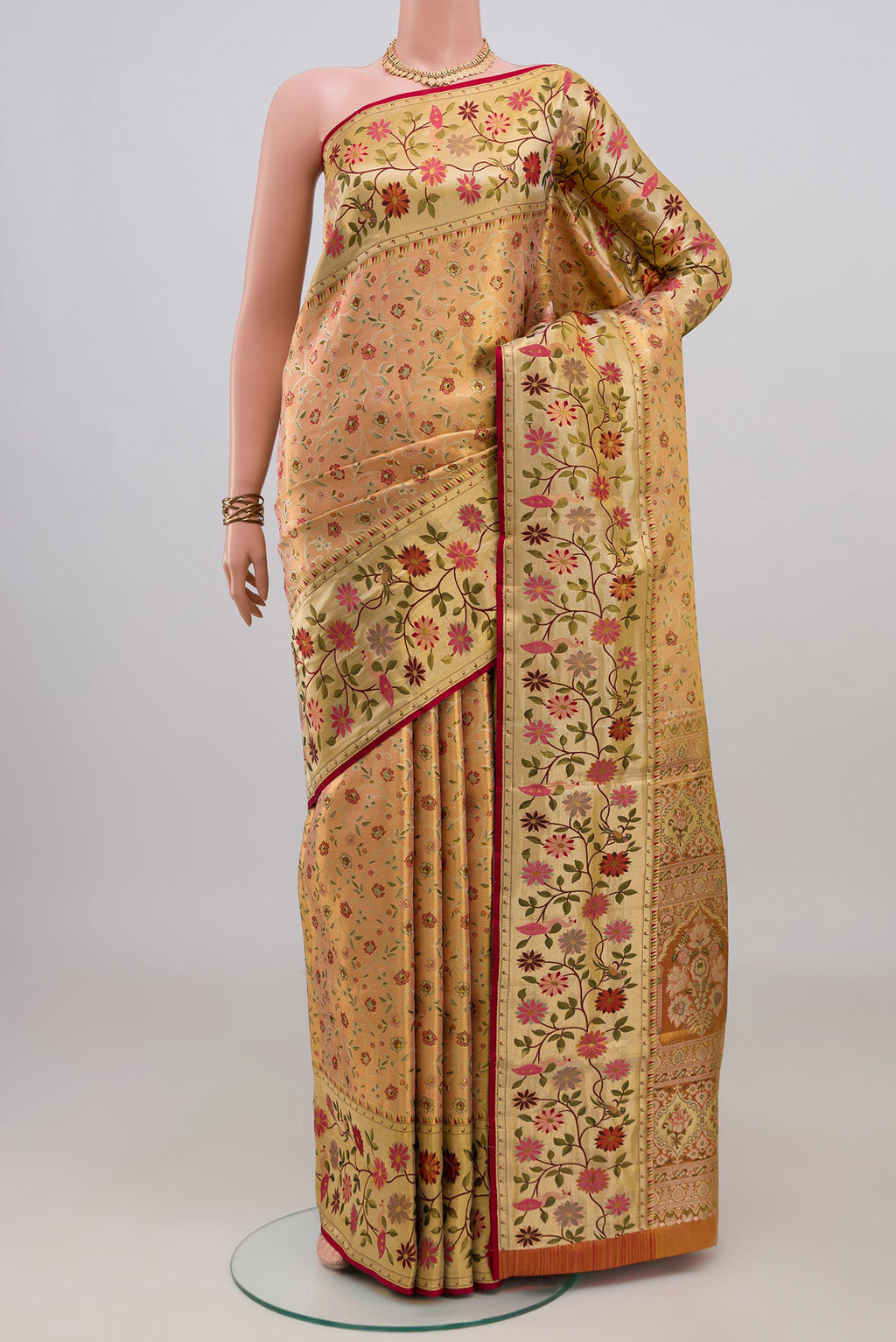 Peach Dual Tone Kanchipuram Tissue Saree with Zari Brocade on the body and Fancy Border.  displayed on a mannequin