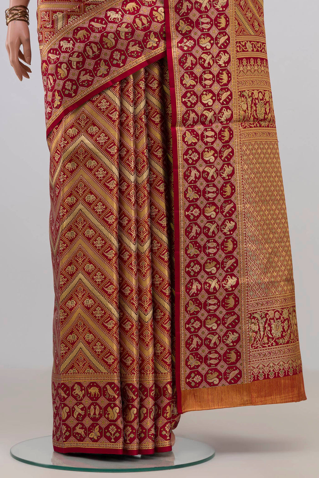 Pleats and pallu of Red Kanchipuram Saree with Zari Brocade on the body and Fancy Border. 