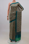 Pure Silk Beige Printed Saree with Printed design on the body and Plain Border.  displayed on a mannequin