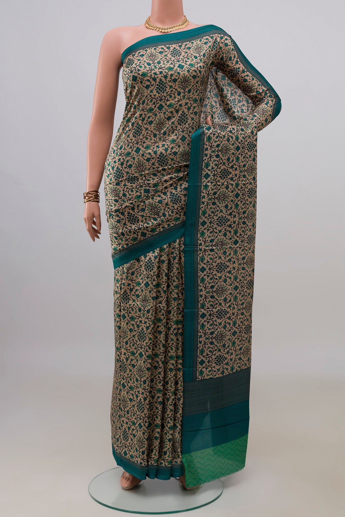Pure Silk Beige Printed Saree with Printed design on the body and Plain Border.  displayed on a mannequin
