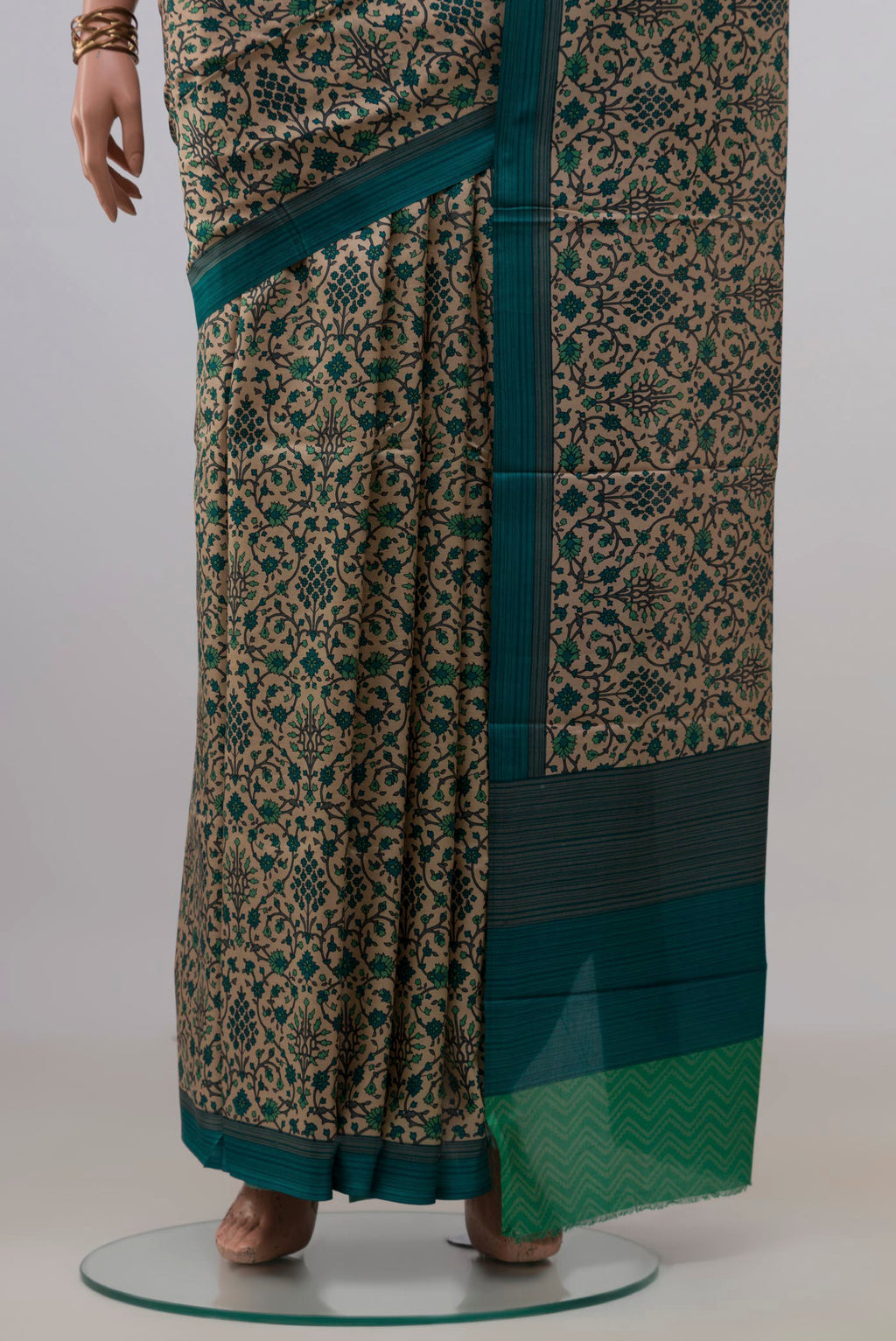 Pleats and pallu of Pure Silk Beige Printed Saree with Printed design on the body and Plain Border. 