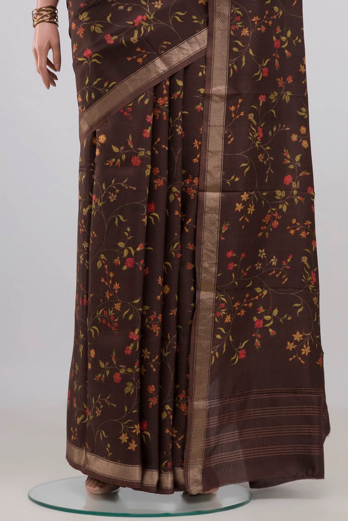 Pleats and pallu of Pure Silk Brown Printed Saree with Printed design on the body and Zari Border. 