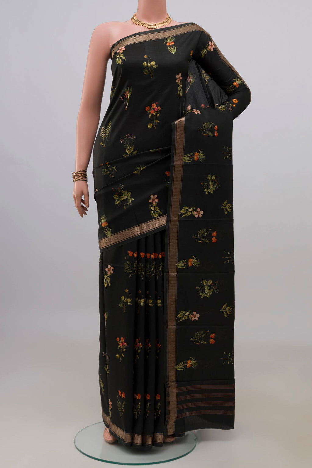 Pure Silk Black Printed Saree with Printed design on the body and Zari Border.  displayed on a mannequin