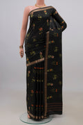 Pure Silk Black Printed Saree with Printed design on the body and Zari Border.  displayed on a mannequin