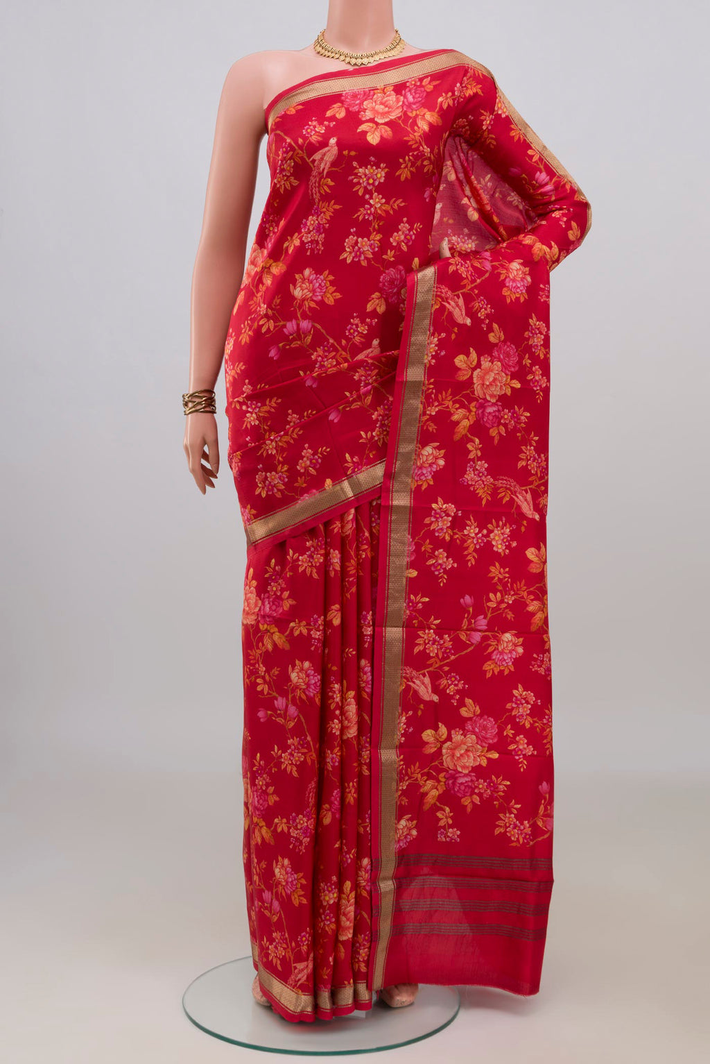 Pure Silk Red Printed Saree with Printed design on the body and Zari Border.  displayed on a mannequin
