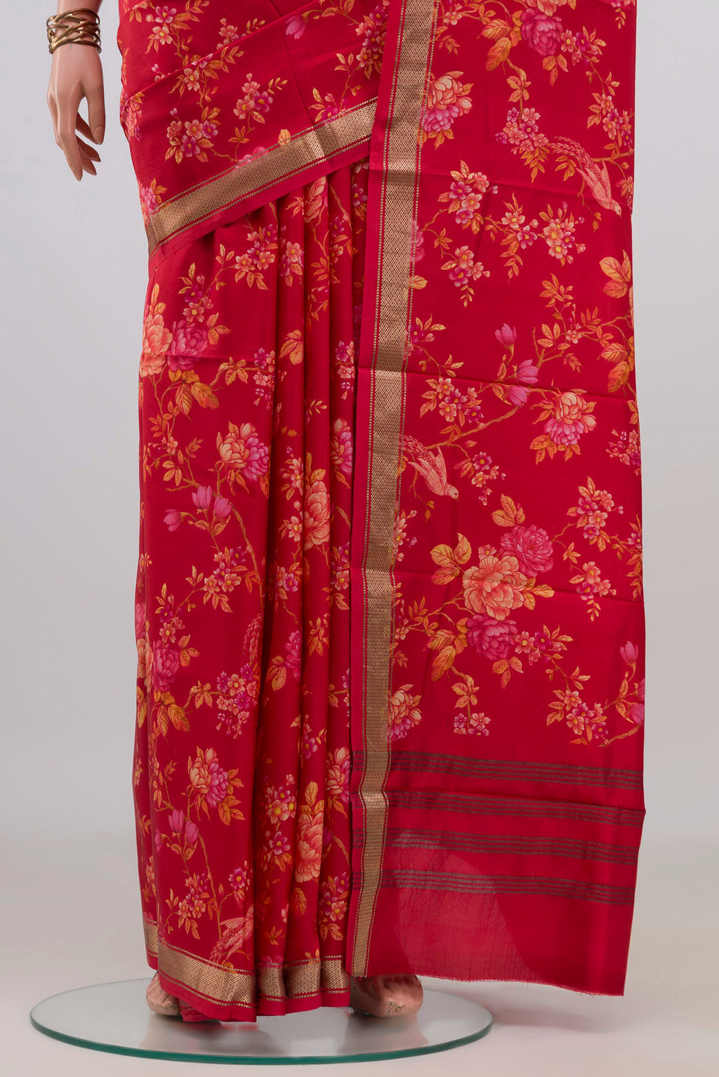 Pleats and pallu of Pure Silk Red Printed Saree with Printed design on the body and Zari Border. 