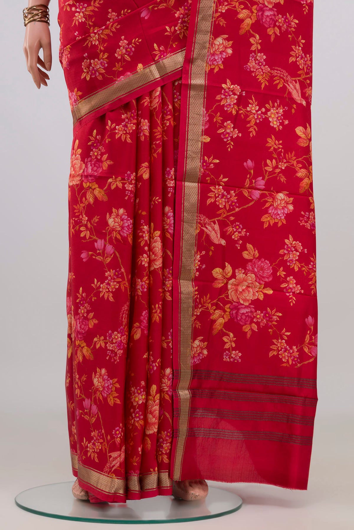 Pleats and pallu of Pure Silk Red Printed Saree with Printed design on the body and Zari Border. 