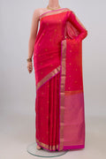 Pure Silk Coral Dual Tone Kanchipuram Saree with Zari Butta on the body and Zari Border.  displayed on a mannequin