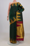 Pure Silk Bottle Green Kanjivaram Saree with Plain Body and Temple Border.  displayed on a mannequin