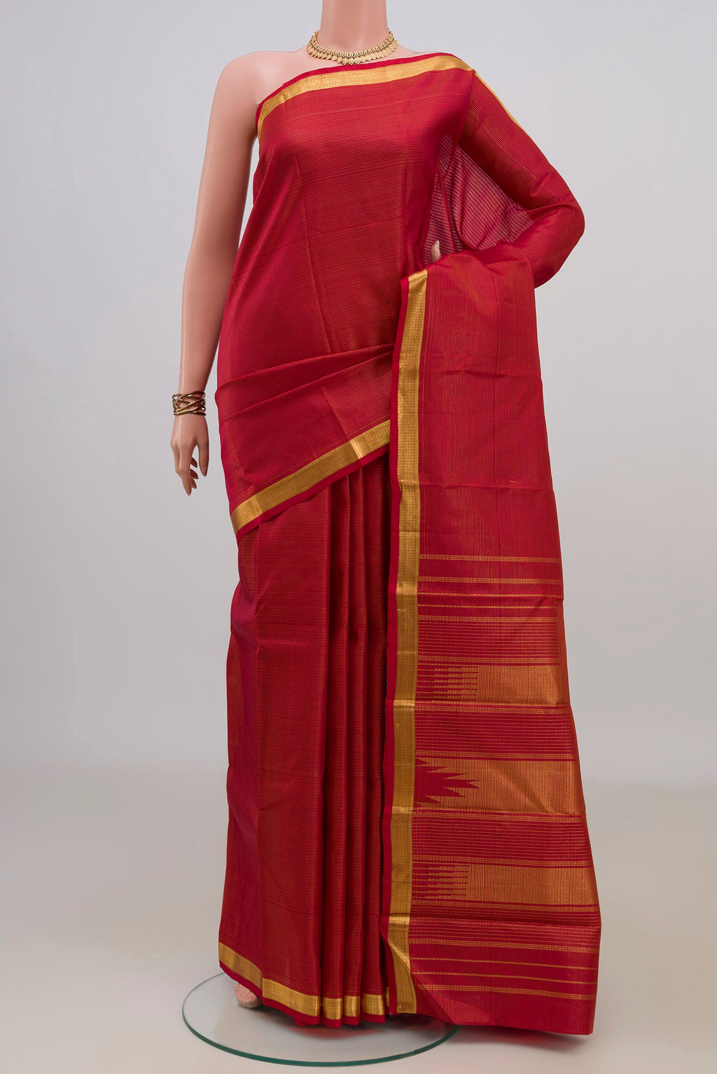 Pure Silk Red Kanjivaram Saree with Stripes on the body and Zari Border.  displayed on a mannequin