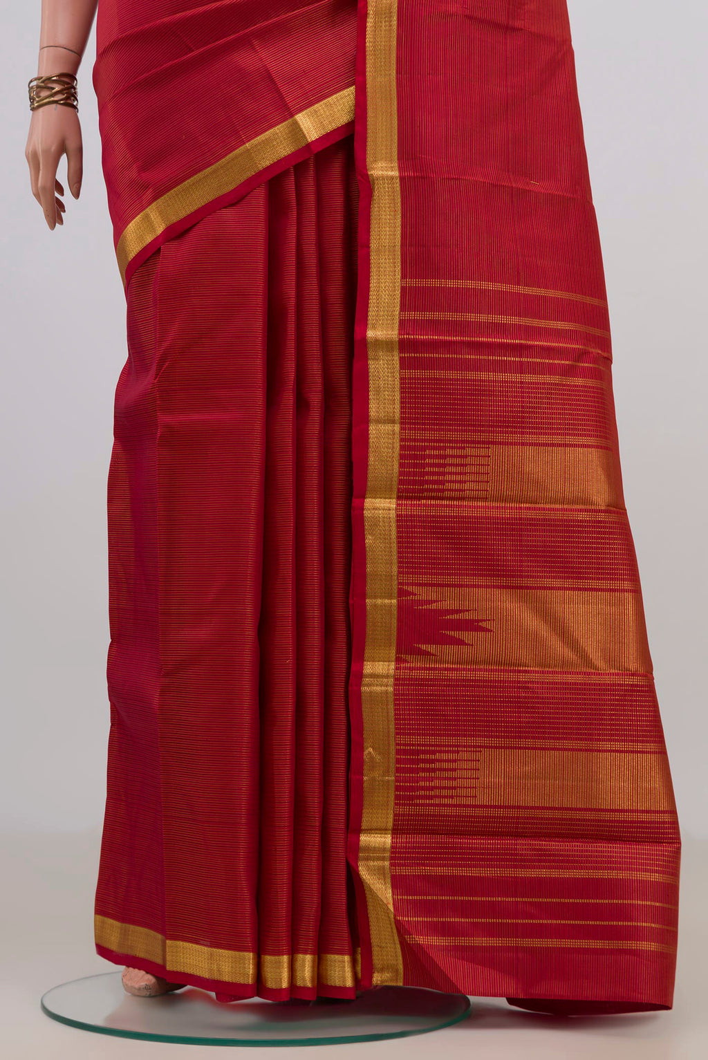 Pleats and pallu of Pure Silk Red Kanjivaram Saree with Stripes on the body and Zari Border. 