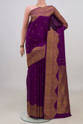 Pure Silk Purple Kanjivaram Saree with Zari Butta on the body and Fancy Border.  displayed on a mannequin