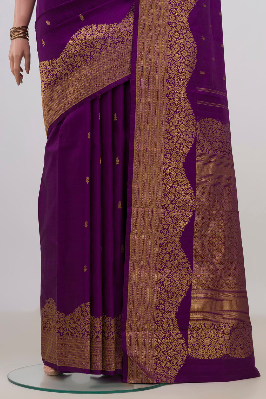 Pleats and pallu of Pure Silk Purple Kanjivaram Saree with Zari Butta on the body and Fancy Border. 