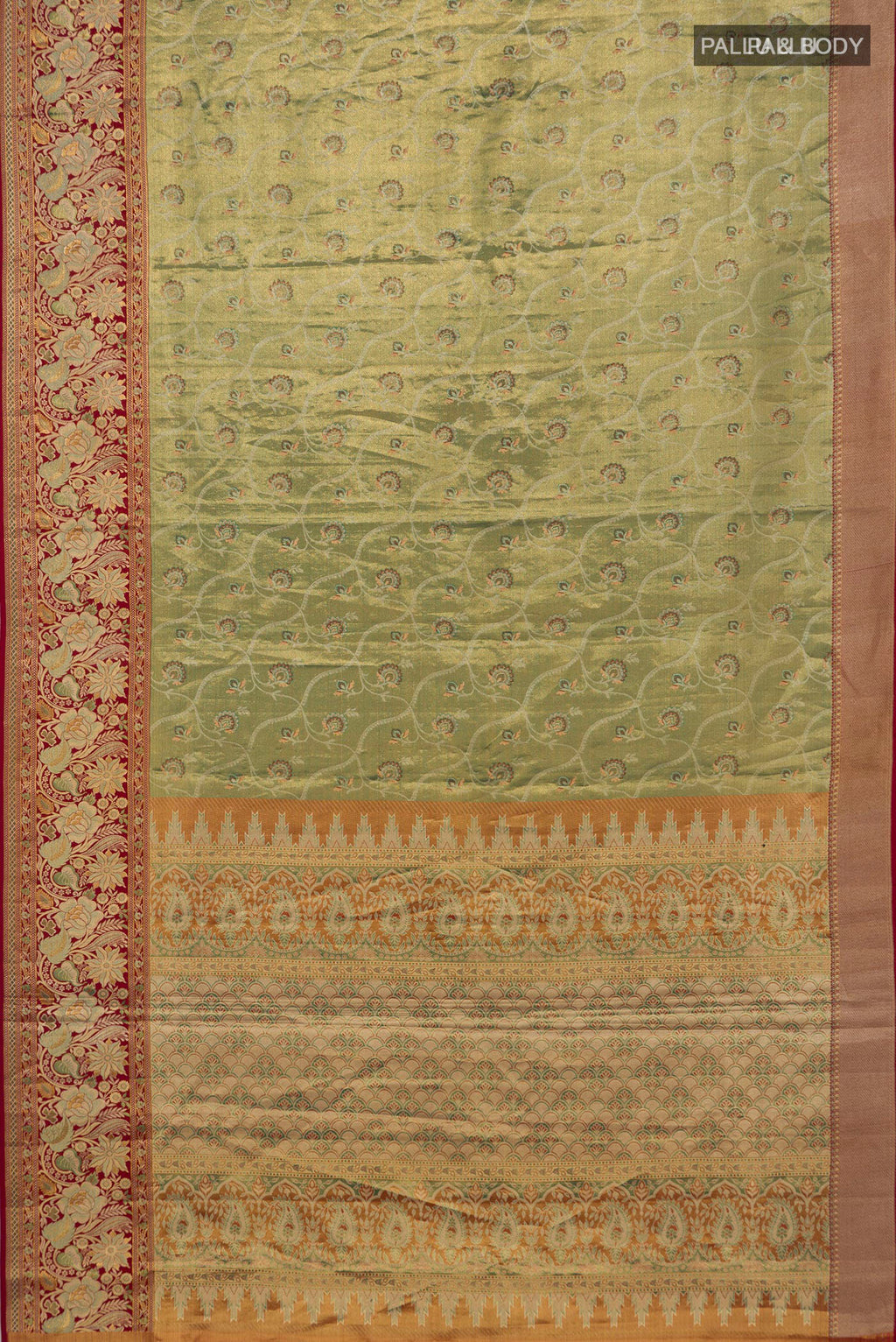 Flat view of Green Dual Tone Kanjivaram Tissue Saree with Zari Brocade on the body and Fancy Border. 
