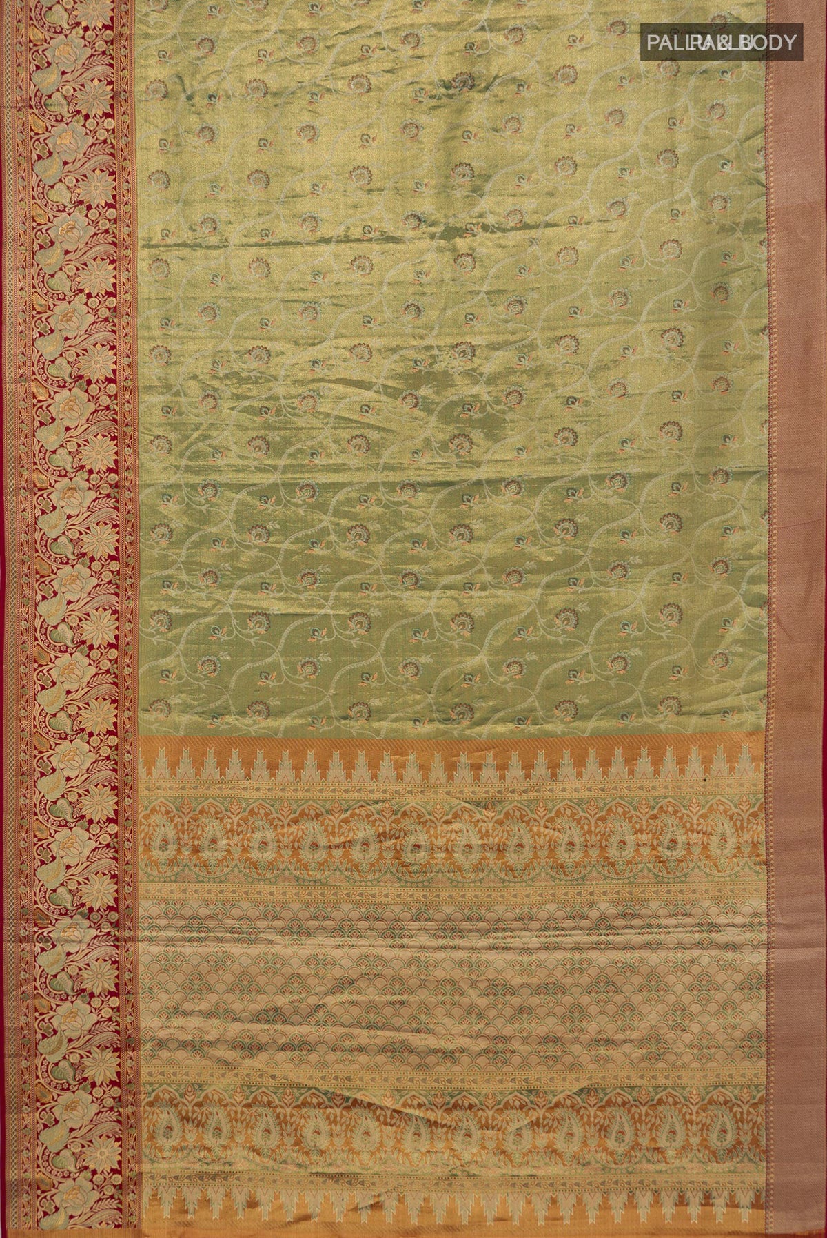 Flat view of Green Dual Tone Kanjivaram Tissue Saree with Zari Brocade on the body and Fancy Border. 