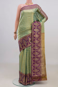 Green Dual Tone Kanjivaram Saree with Zari Brocade on the body and Fancy Border.  displayed on a mannequin