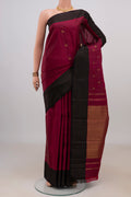 Pure Silk Pure Zari Maroon Kanchipuram Saree with Zari Butta on the body and Plain Border.  displayed on a mannequin