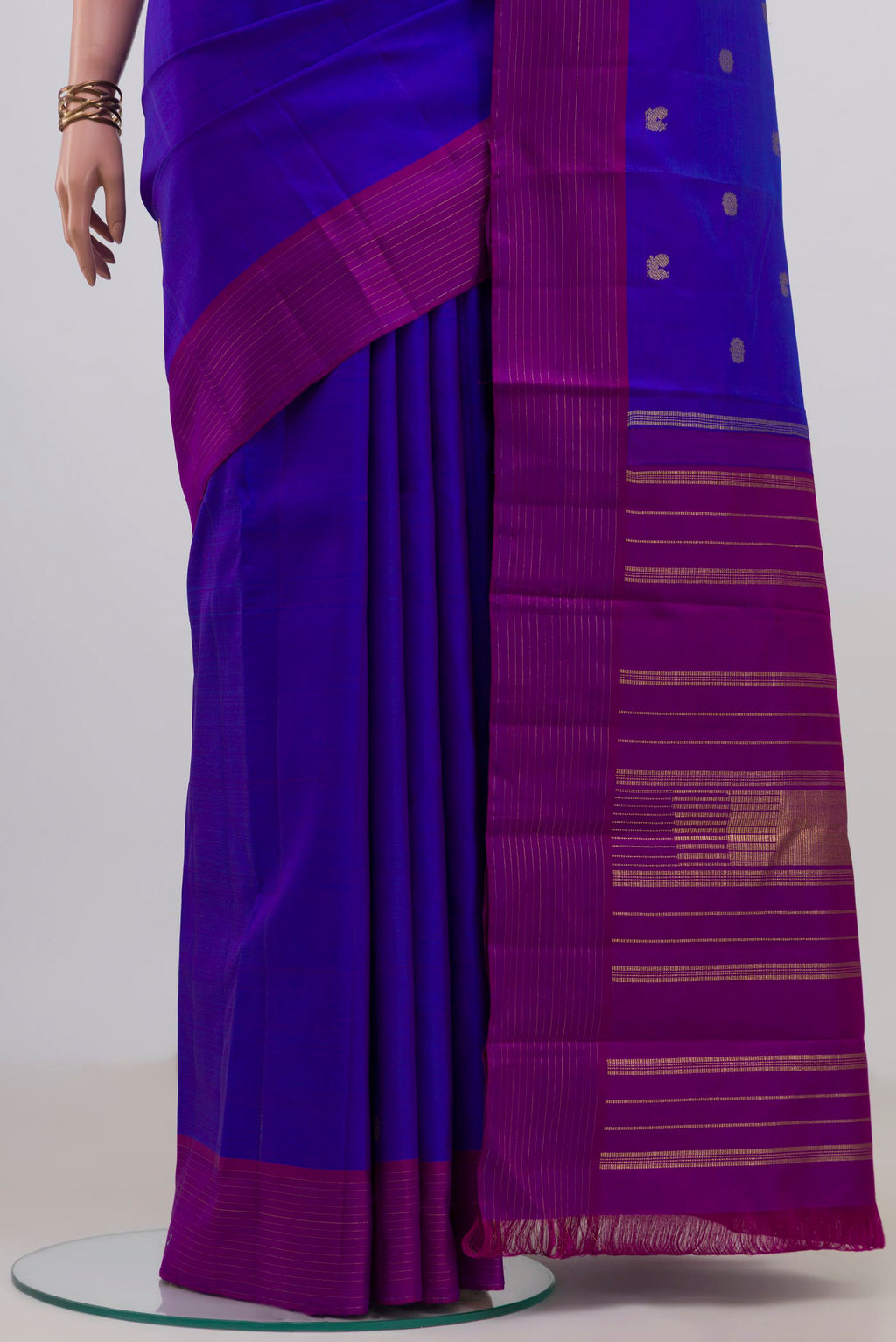 Pleats and pallu of Pure Silk Pure Zari Royal Blue Kanjivaram Saree with Zari Butta on the body and Plain Border. 