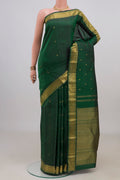 Pure Silk Pure Zari Bottle Green Kanjivaram Saree with Zari Butta on the body and Zari Border.  displayed on a mannequin