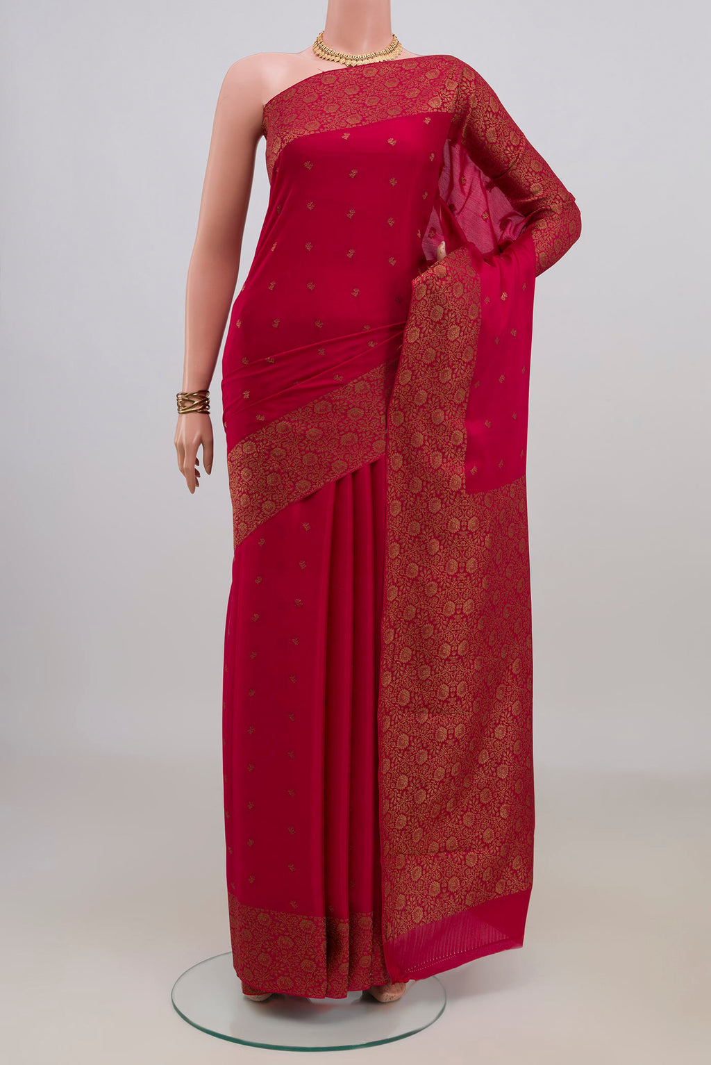 Pink Mysore Crepe Saree with Zari Butta on the body and Fancy Border.  displayed on a mannequin