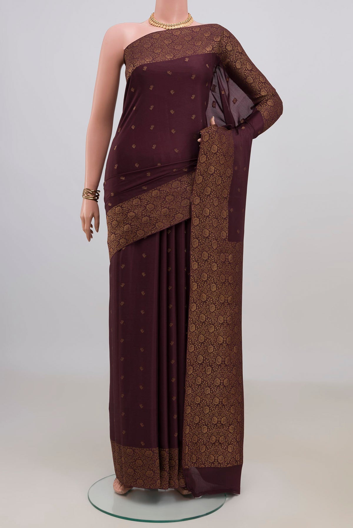 Coffee Brown Mysore Crepe Saree with Zari Butta on the body and Fancy Border.  displayed on a mannequin