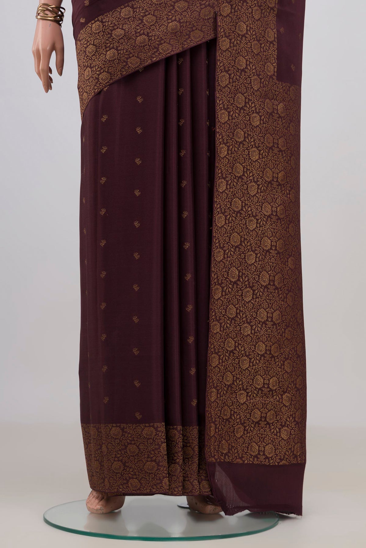 Pleats and pallu of Coffee Brown Mysore Crepe Saree with Zari Butta on the body and Fancy Border. 