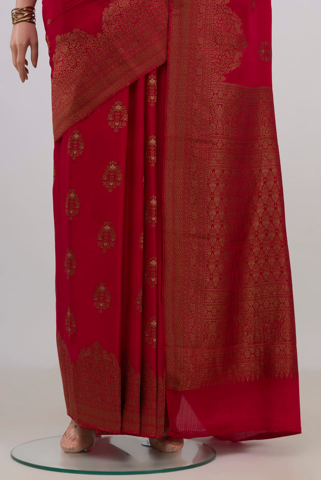 Pleats and pallu of Red Mysore Crepe Saree with Zari Butta on the body and Fancy Border. 