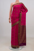 Pink Crepe Saree with Zari Butta on the body and Zari Border.  displayed on a mannequin